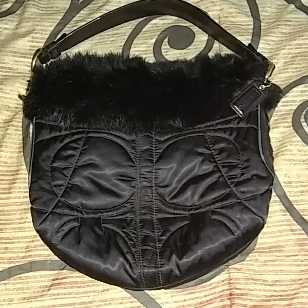 Authentic Coach Bag with Fur lining the top.